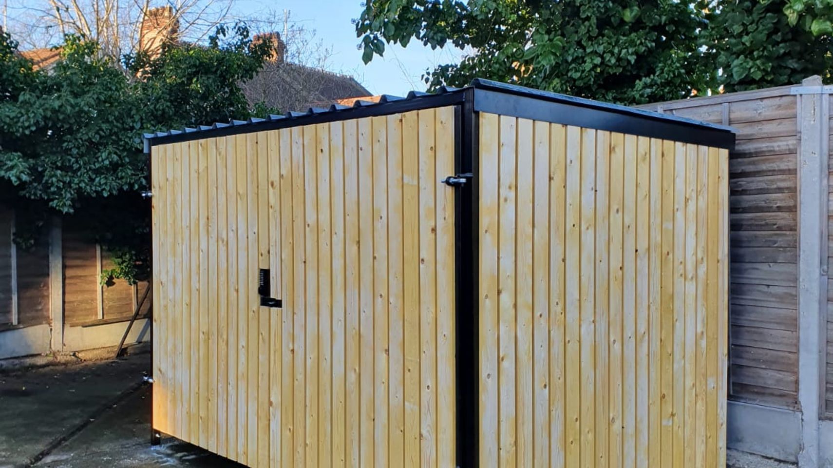 8 Space timber clad cycle shelter side and front.jpg