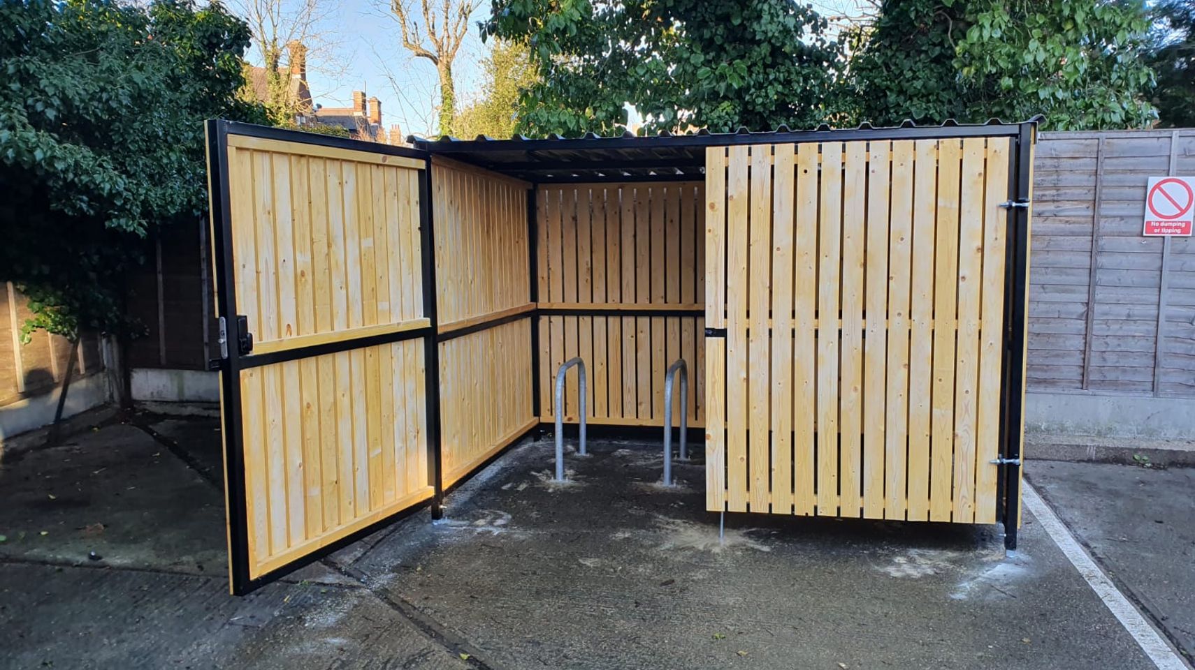 8 Space timber clad cycle shelter one gate open.jpg
