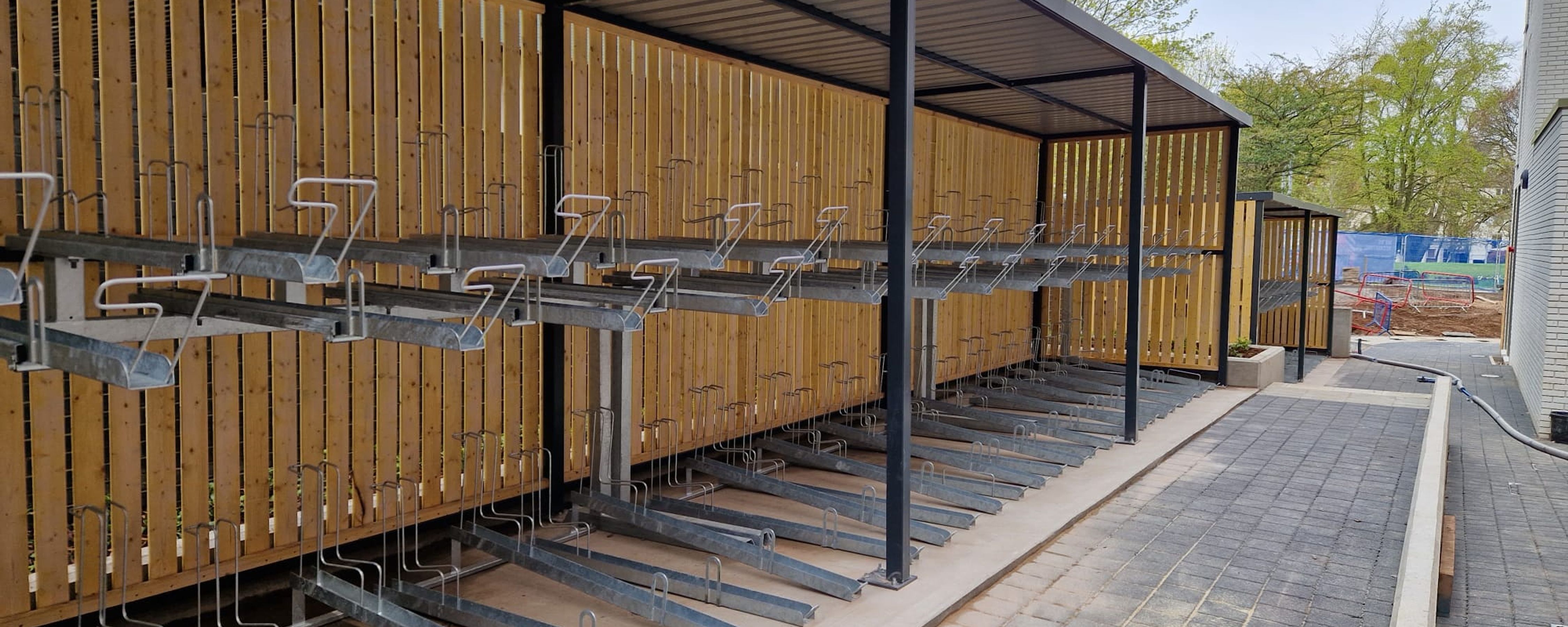 Fabricated Steel Bike Shelter With Vertical Racks in Mesh Cage Finish