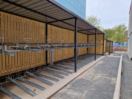 Fabricated Steel Bike Shelter With Vertical Racks in Mesh Cage Finish