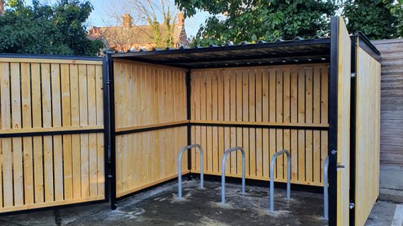 8 Space timber clad cycle shelter gates open.jpg