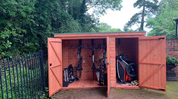 Fence supported bike shelter best sale