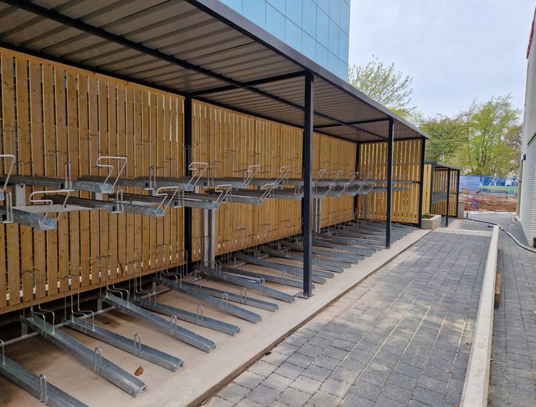 Fabricated Steel Bike Shelter With Vertical Racks in Mesh Cage Finish