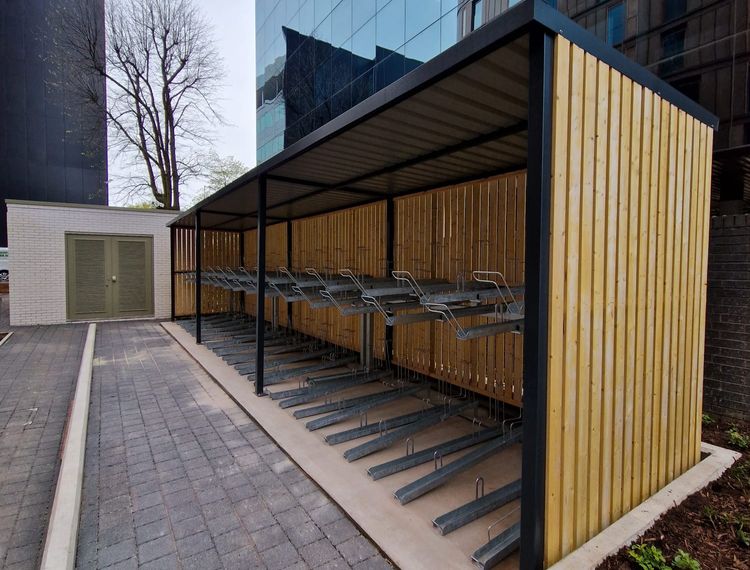 Fabricated Steel Bike Shelter With Vertical Racks in Mesh Cage Finish