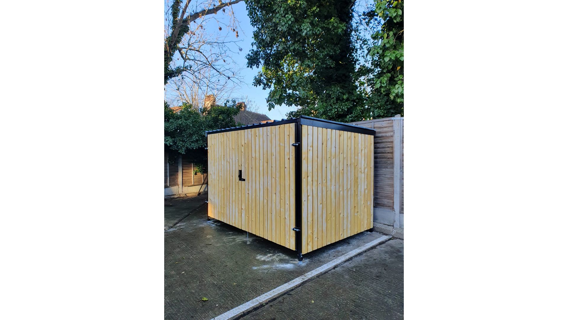 8 Space timber clad cycle shelter side and front.jpg