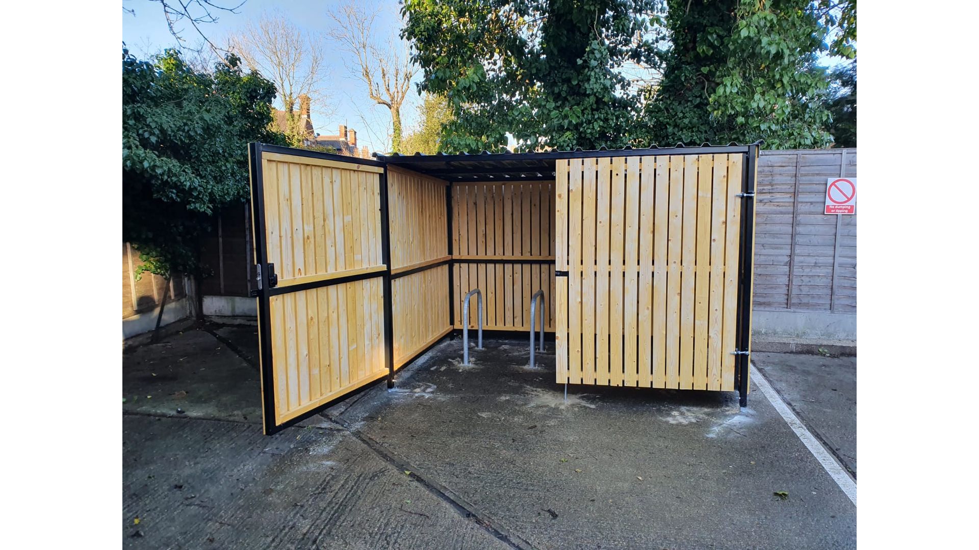 8 Space timber clad cycle shelter one gate open.jpg