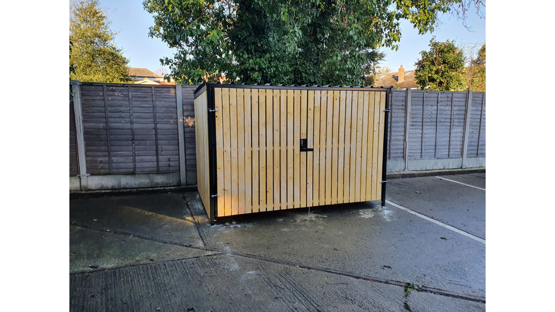 8 Space timber clad cycle shelter front gate closed.jpg