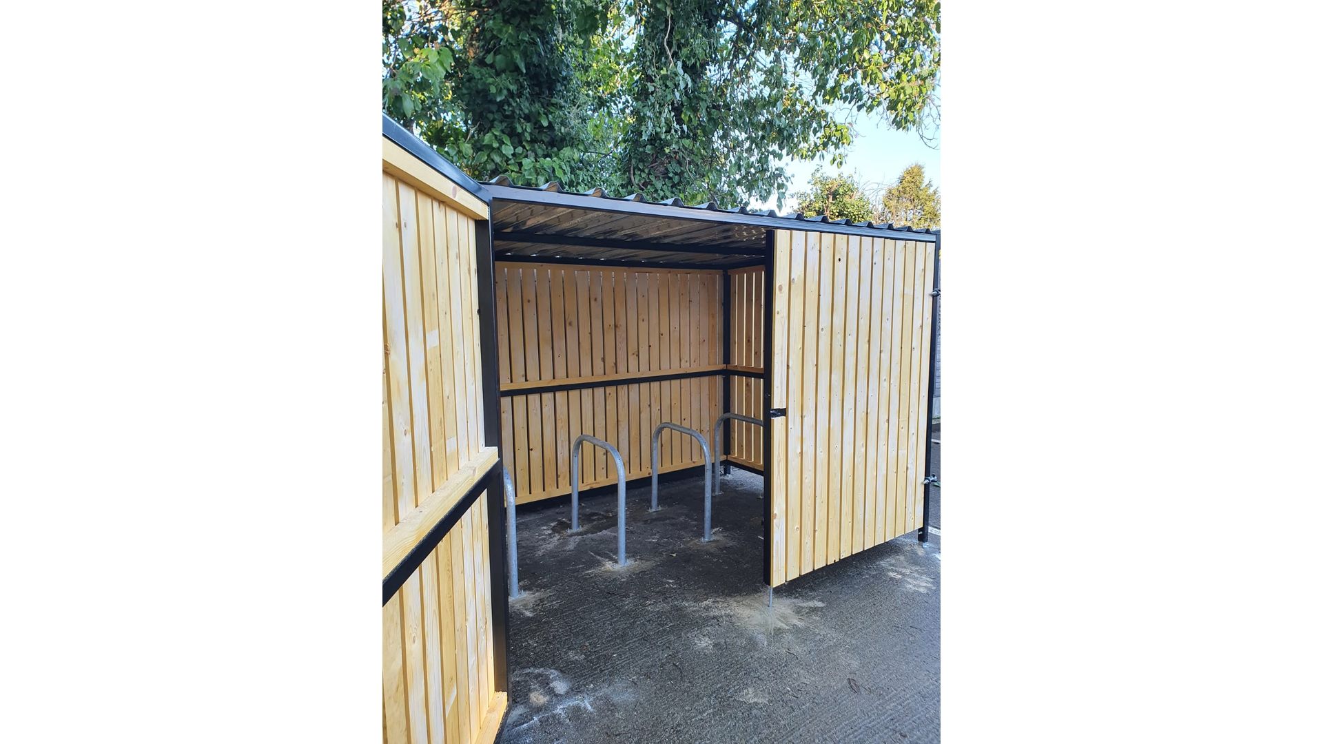 8 Space timber clad cycle shelter one gate open 01.jpg