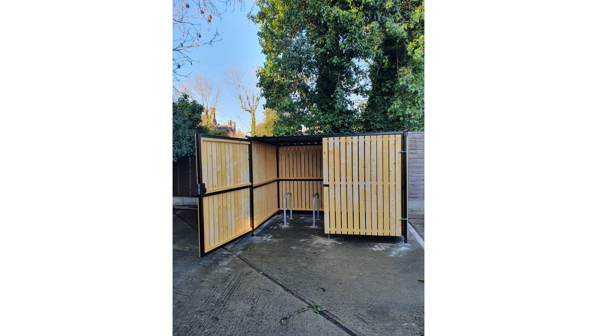 8 Space timber clad cycle shelter open gate.jpg