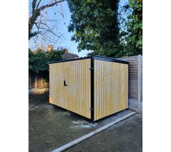 8 Space timber clad cycle shelter side and front.jpg