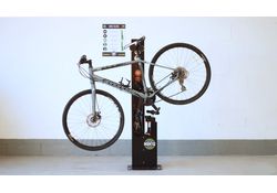 Public bike repair stand with pump 