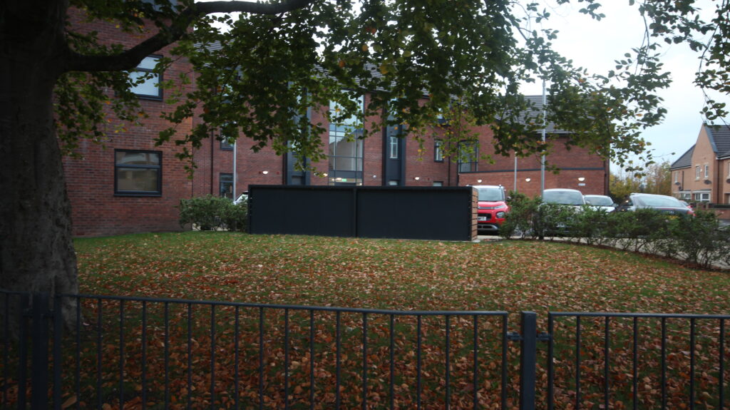Secure Cycle Store's newly installed, 2 bike lockers with a bespoke timber clad facade housing 6 lockers. Outdoors, adjacent to the residential car park.