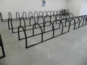 newly installed Sheffield Toast Racks, painted black inside an Indoor bike storage facility.