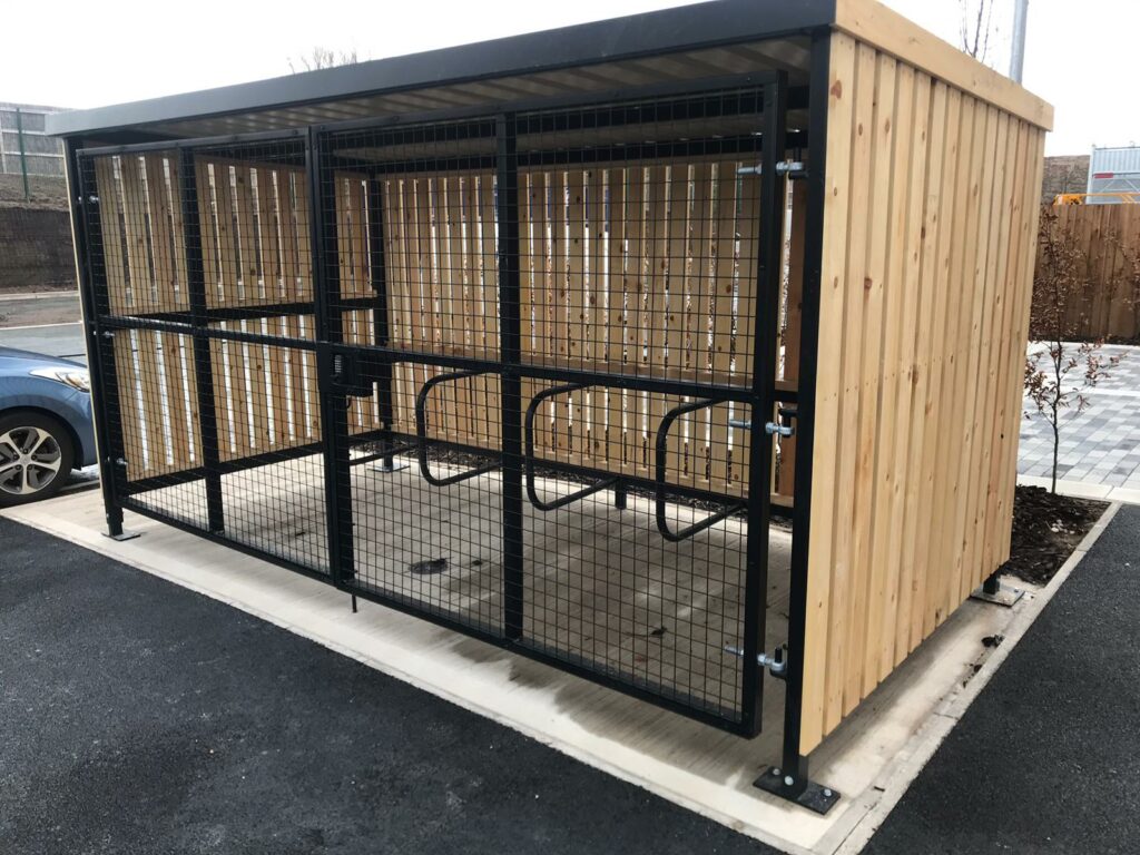 Secure Cycle Store's Trinity Timber Bike Shelter, housing Sheffield bike Stands with a mesh front and gate. All secured with a Digital combination lock for the amazing staff of St. Helens FIRE STATION.