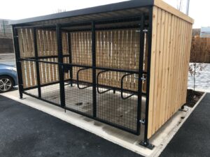 Secure Cycle Store's Trinity Timber Bike Shelter, housing Sheffield bike Stands with a mesh front and gate. All secured with a Digital combination lock for the amazing staff of St. Helens FIRE STATION.