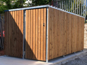 Newly installed, bespoke timber clad bike shelter, housing 10 bike spaces with Semi-vertical bike Racks. Delivered and assembled for Hamilton Church in this outdoor location.