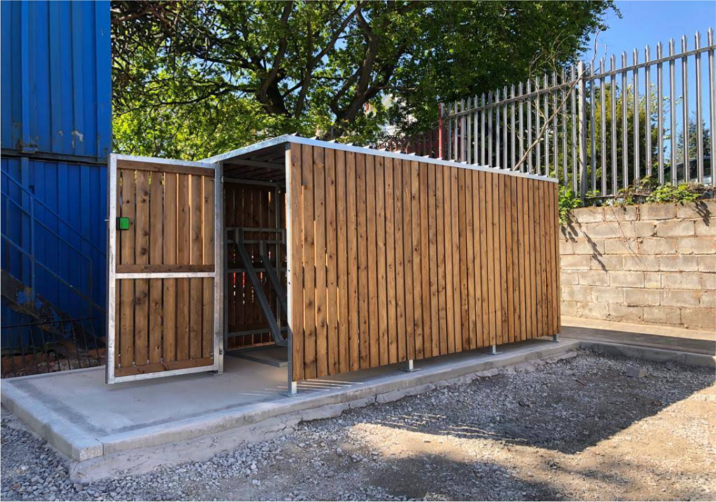 Newly installed, bespoke timber clad bike shelter, housing 10 bike spaces with Semi-vertical bike Racks. Delivered and assembled for Hamilton Church in this outdoor location. 