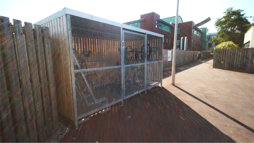 THE WALTON CENTRE timber clad bike shelter, outdoors and newly installed for the NHS Walton hospital staff