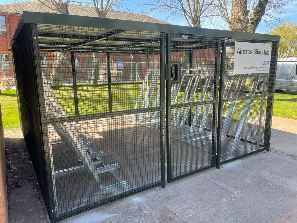 The Walton Centre Bike Hub, bespoke merton mesh bike shelter with semi-vertical bike racks and vast amounts of security features. designed, supplied and installed by Secure Cycle Store.