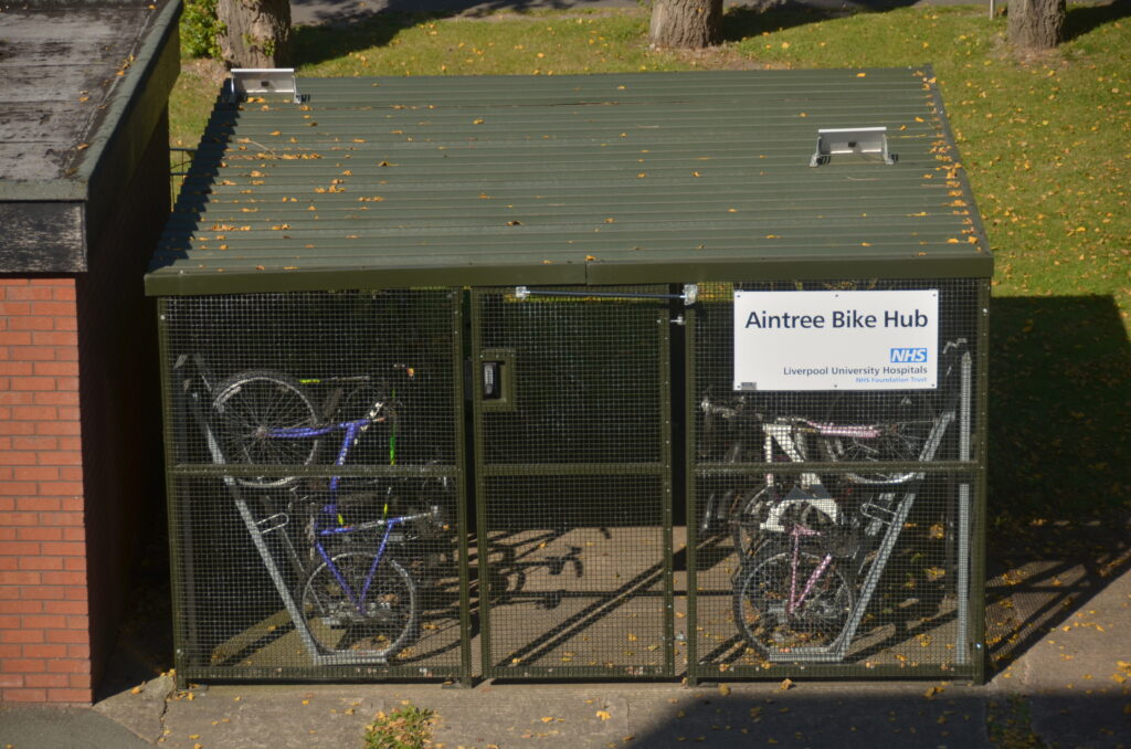 The Walton Centre Bike Hub, bespoke merton mesh bike shelter with semi-vertical bike racks and vast amounts of security features. designed, supplied and installed by Secure Cycle Store.