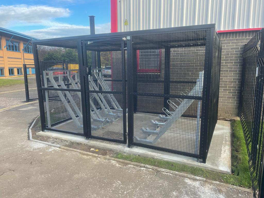 Secure Cycle Store's bespoke merton mesh bike shelter, installed outdoors with RAL 9005 Black finish. Located in South Gyle Crescent, Edinburgh. 
