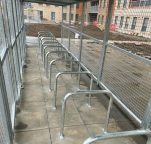 Two of seven Merton Mesh Bike Shelters, housing semi-vertical bike racks for Butterbiggins Road, Glasgow.
