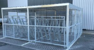 newly installed merton mesh bike shelter, located outdoors behind the hello fresh bin.