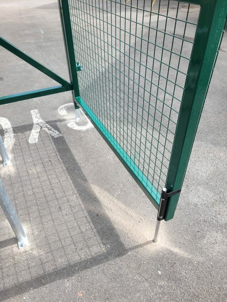 Installation featuring galvanised steel frame, PETG cladding and Sheffield stands for 8 bikes. Durable, weather-resistant, secure solution.