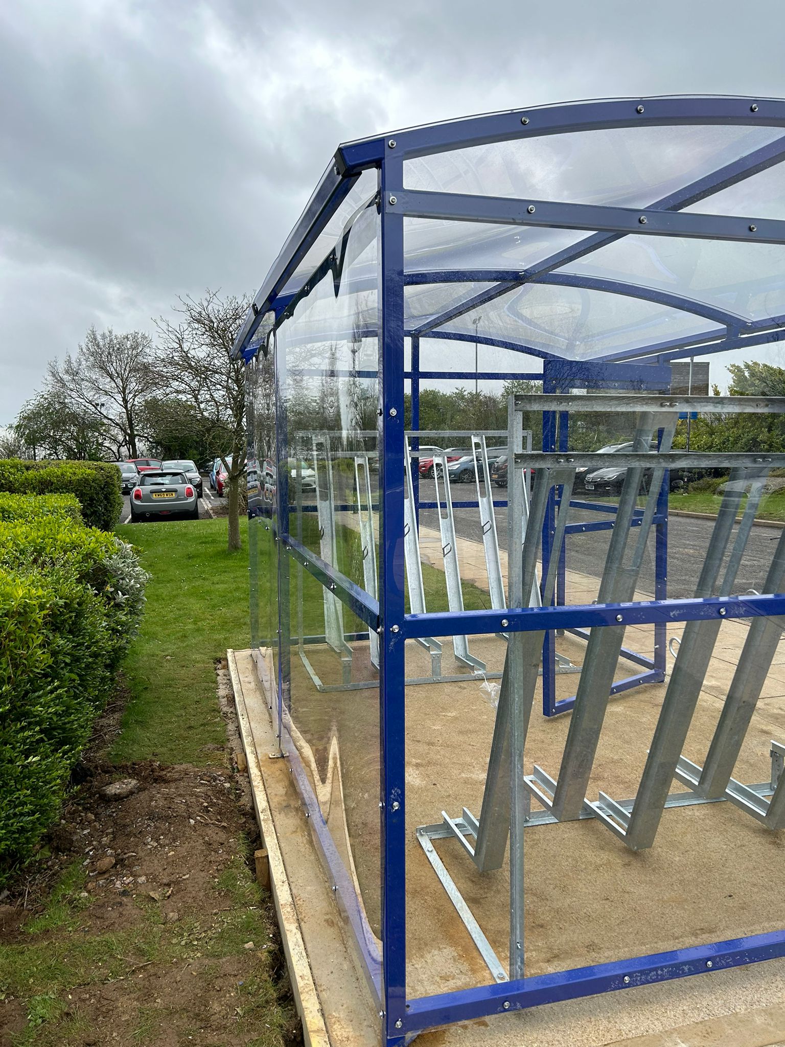 Internally, the shelter is equipped with Semi-Vertical Cycle Racks, 