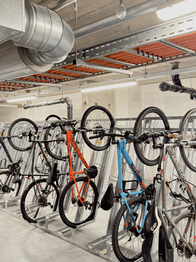 Featuring our durable Semi-Vertical Bike Racks designed with a 3 point-locking system for enhanced bicycle security. The system, holding 244 bicycles, was expertly fitted on the building’s ground floor