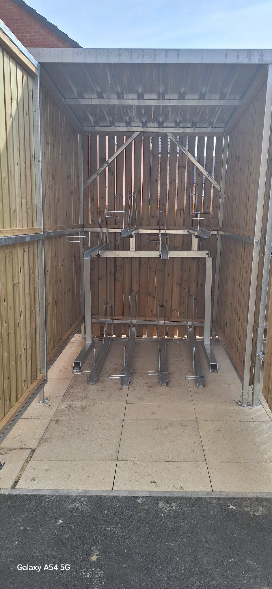 Discover our 8 Space Two Tier Timber Clad Cycle Shelter featuring galvanised steel construction, secure timber cladding and space-saving.