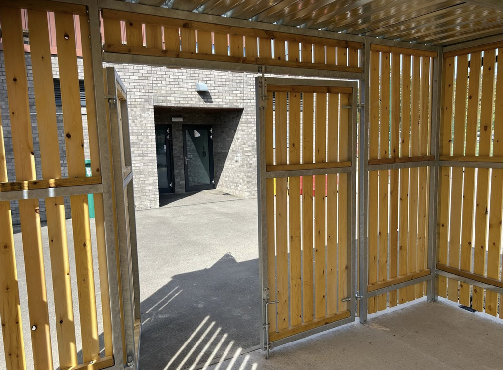 The complete structure was supplied and professionally installed on site, including the steel framework, timber cladding, roofing, flashings and secure gates.