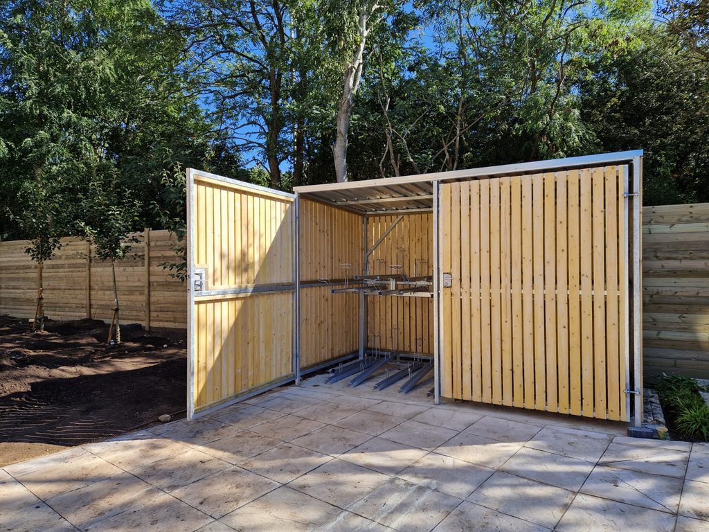 Timber-clad cycle shelters and bin stores supplied and installed at Maple Road,